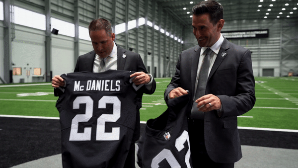 McDaniels and Ziegler hold up jerseys